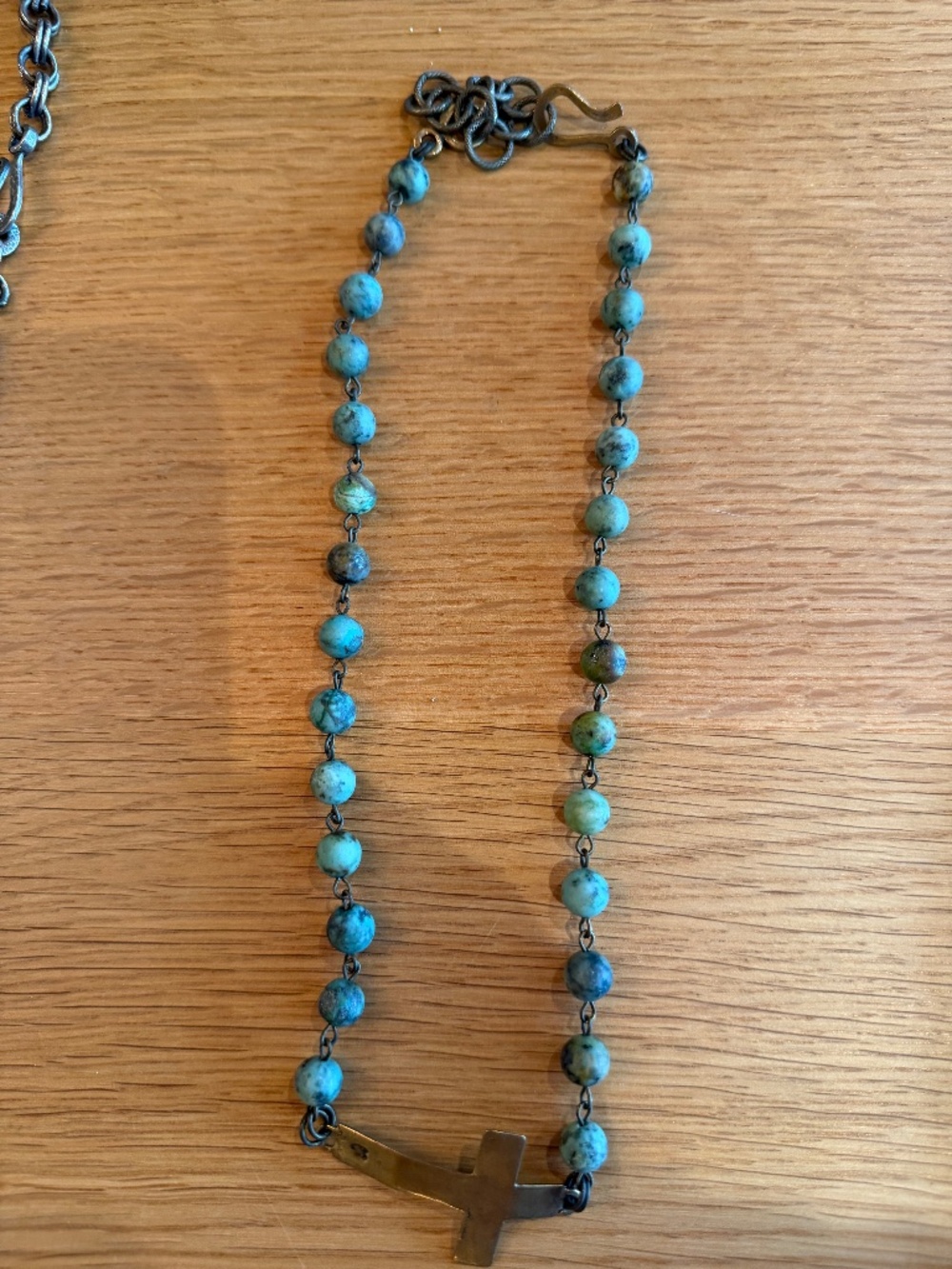 Beaded necklace with bronze metal